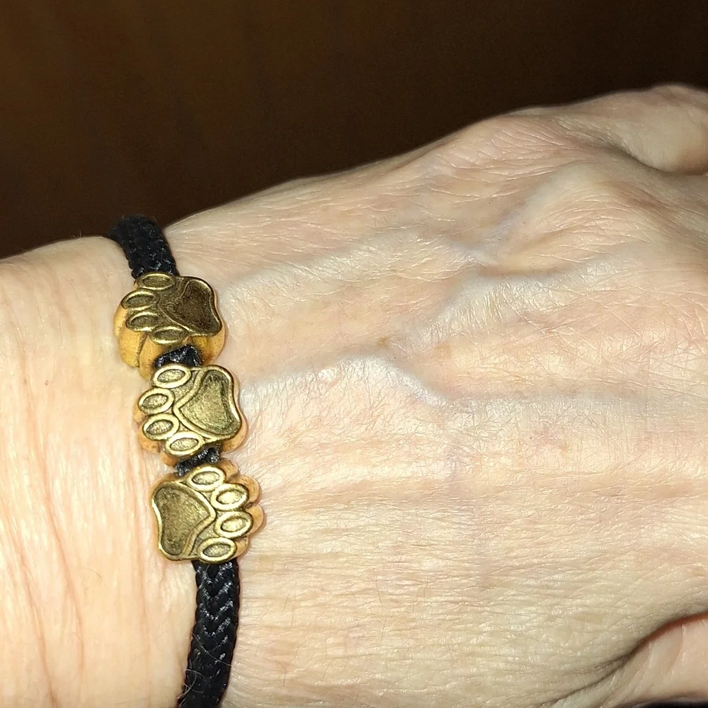 Gold Toned BEAR PAW Beaded BLACK Cord Pull Style BRACELET Unisex